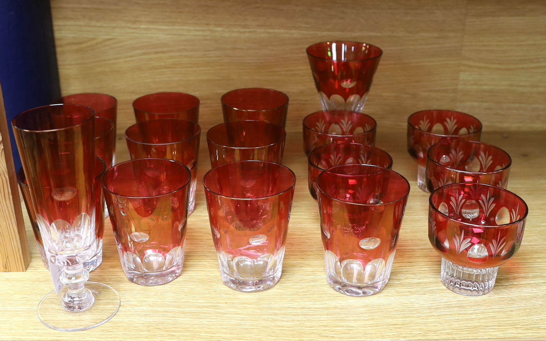 A quantity of cranberry flashed glasses including a set of five, the largest 18cm high